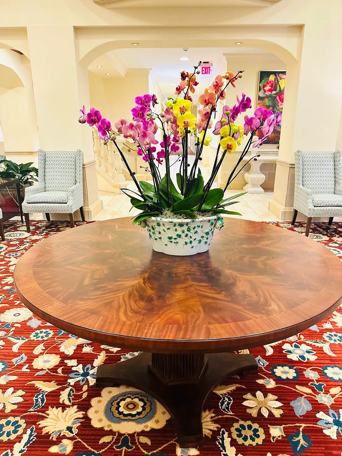 Magenta orchid arrangement in a green speckled pot, by The Orchid Lady in Sarasota