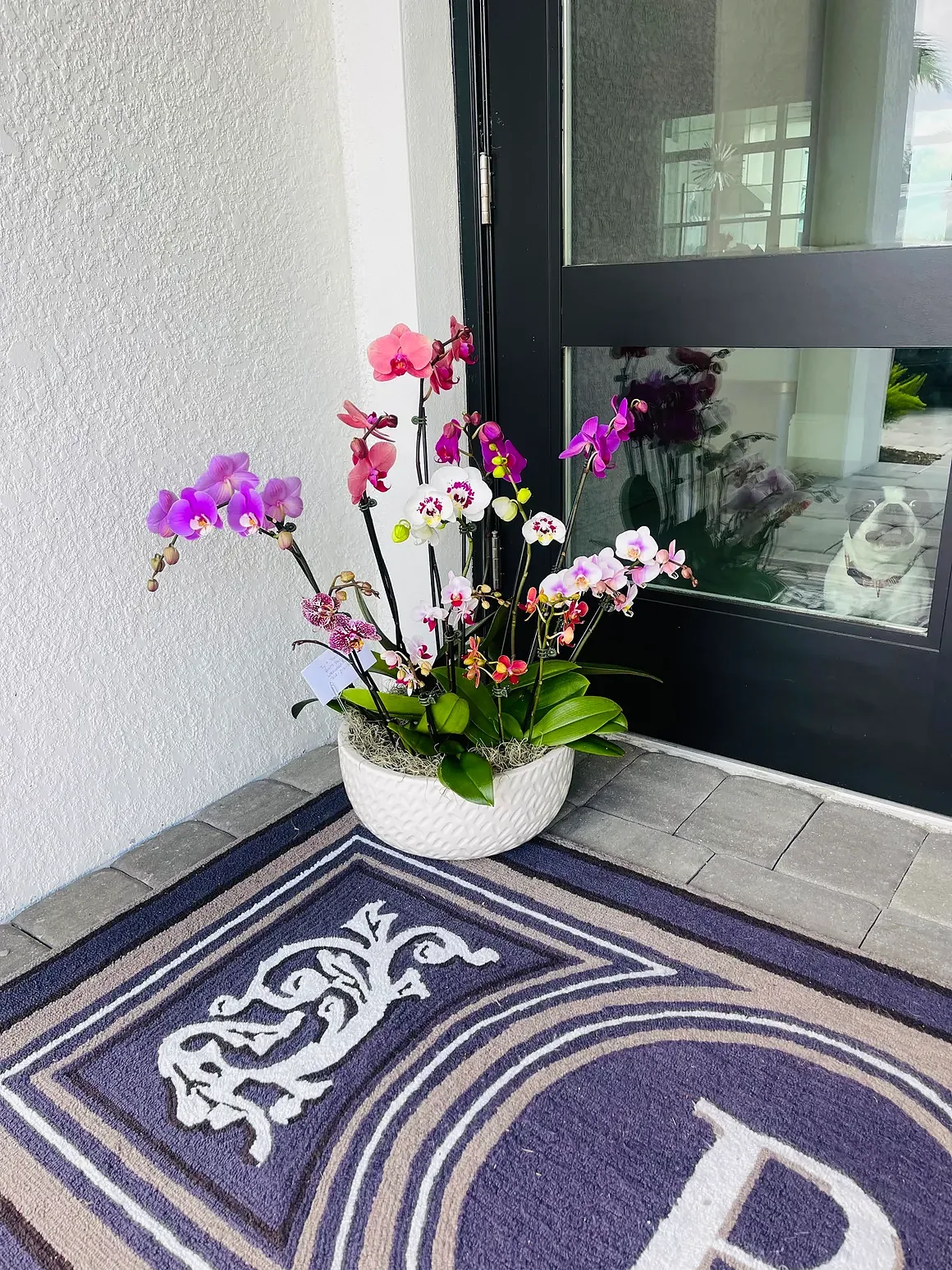 Pink orchid arrangement in a white bowl, by The Orchid Lady in Sarasota
